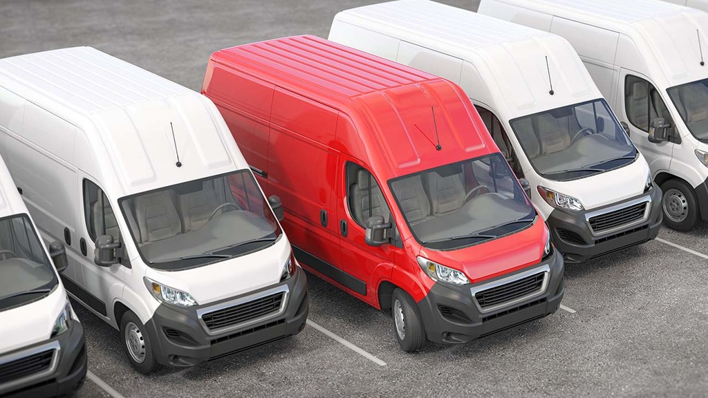 red van in line of white vans